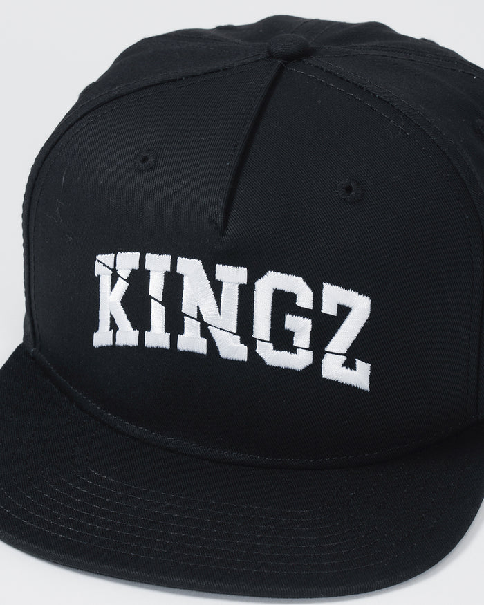 Kingz Slice Snapback - Black - Close-Up Front View Bold White KINGZ Text Centered Black Structured Crown Flat Brim Eyelets Streetwear Style BJJ Training Hat [color:Black]