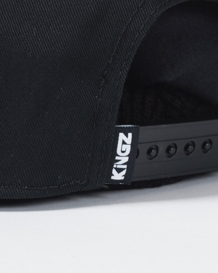 Kingz Slice Snapback Black - Close-Up Detail View Black Fabric KINGZ White Text Tag Adjustable Snap Closure BJJ Training Hat [color:Black]