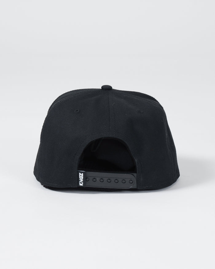 Kingz Slice Snapback Black - Back View Black Hat Adjustable Snap Closure KINGZ Logo Tag Minimalist Design Casual Streetwear BJJ MMA Training [color:Black]