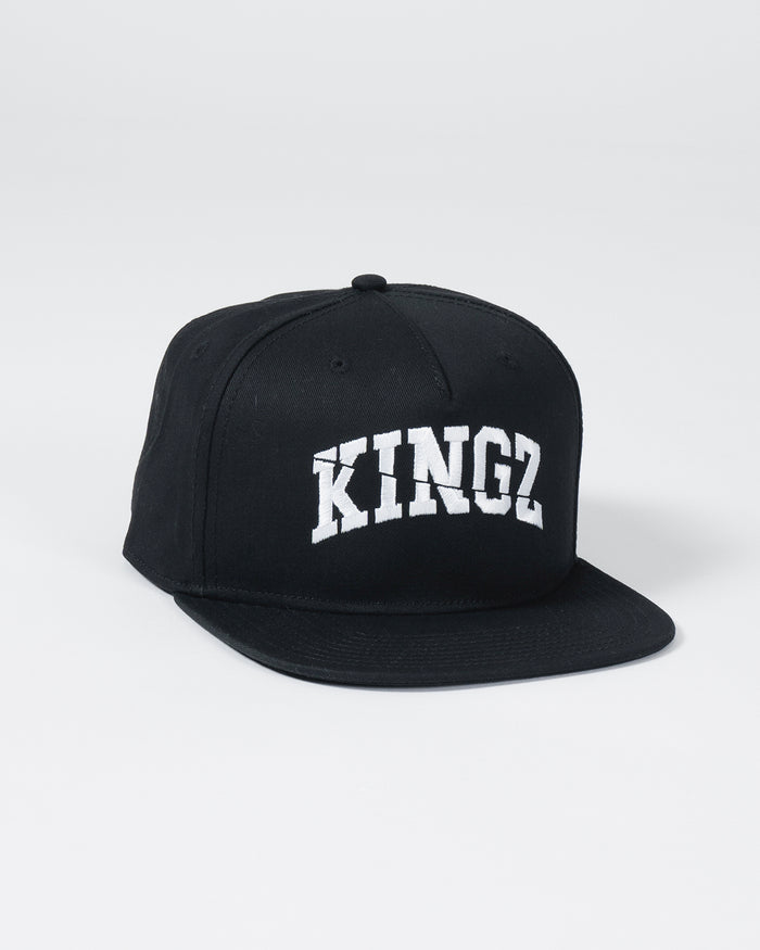 Kingz Slice Snapback - Black - Angled Front View Black Hat Bold White KINGZ Text Flat Brim Classic Snapback Design Embroidered Logo BJJ Lifestyle Apparel [color:Black]