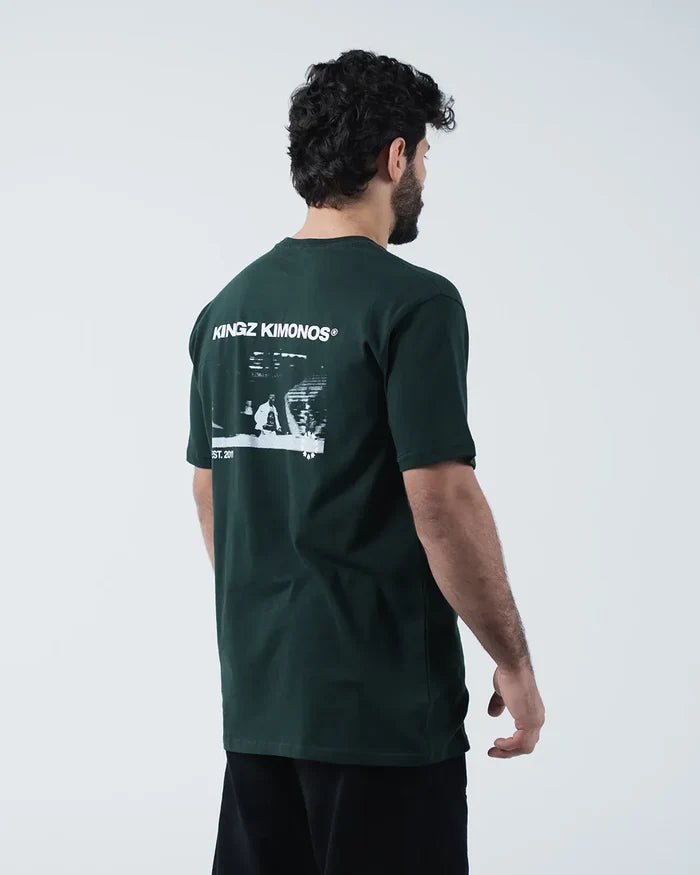 Kingz Solo Tee - Back Three Quarter Angle - Kingz Kimonos BJJ Photo Print Back Side View - Dark Forest Green [color:Dark Forest Green]