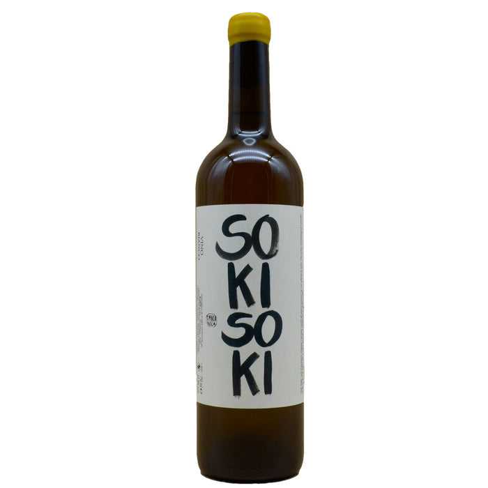Wine bottle in dark glass with yellow cap; label shows '50 KI 50 KI'