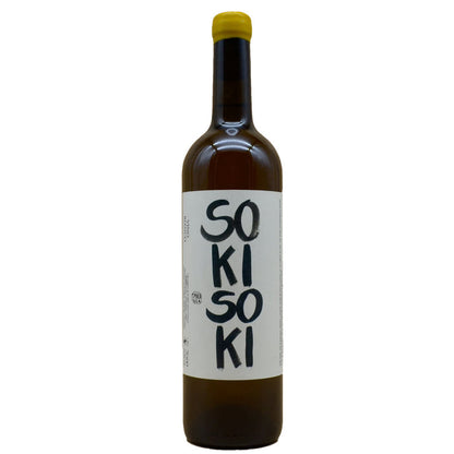Wine bottle in dark glass with yellow cap; label shows '50 KI 50 KI'