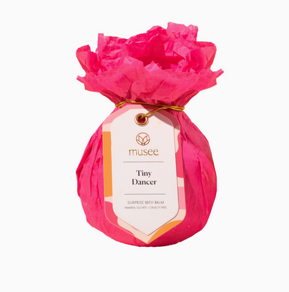 Pink wrapped product with a Musee label on a white background